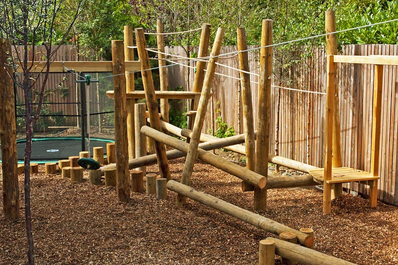 Rope & log climbing frame, balancing beams and in-ground trampoline